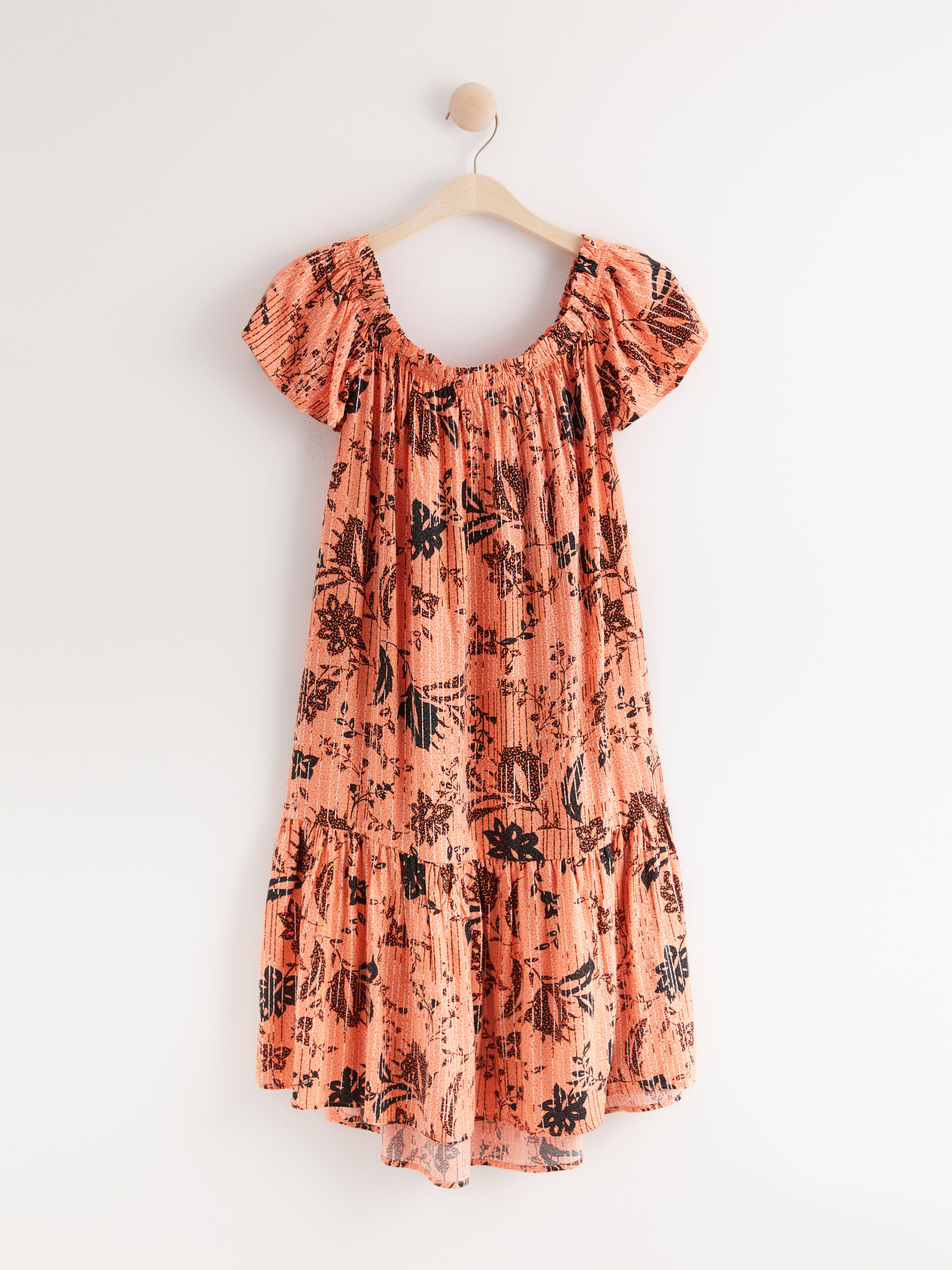 Off shoulder-klänning med volang