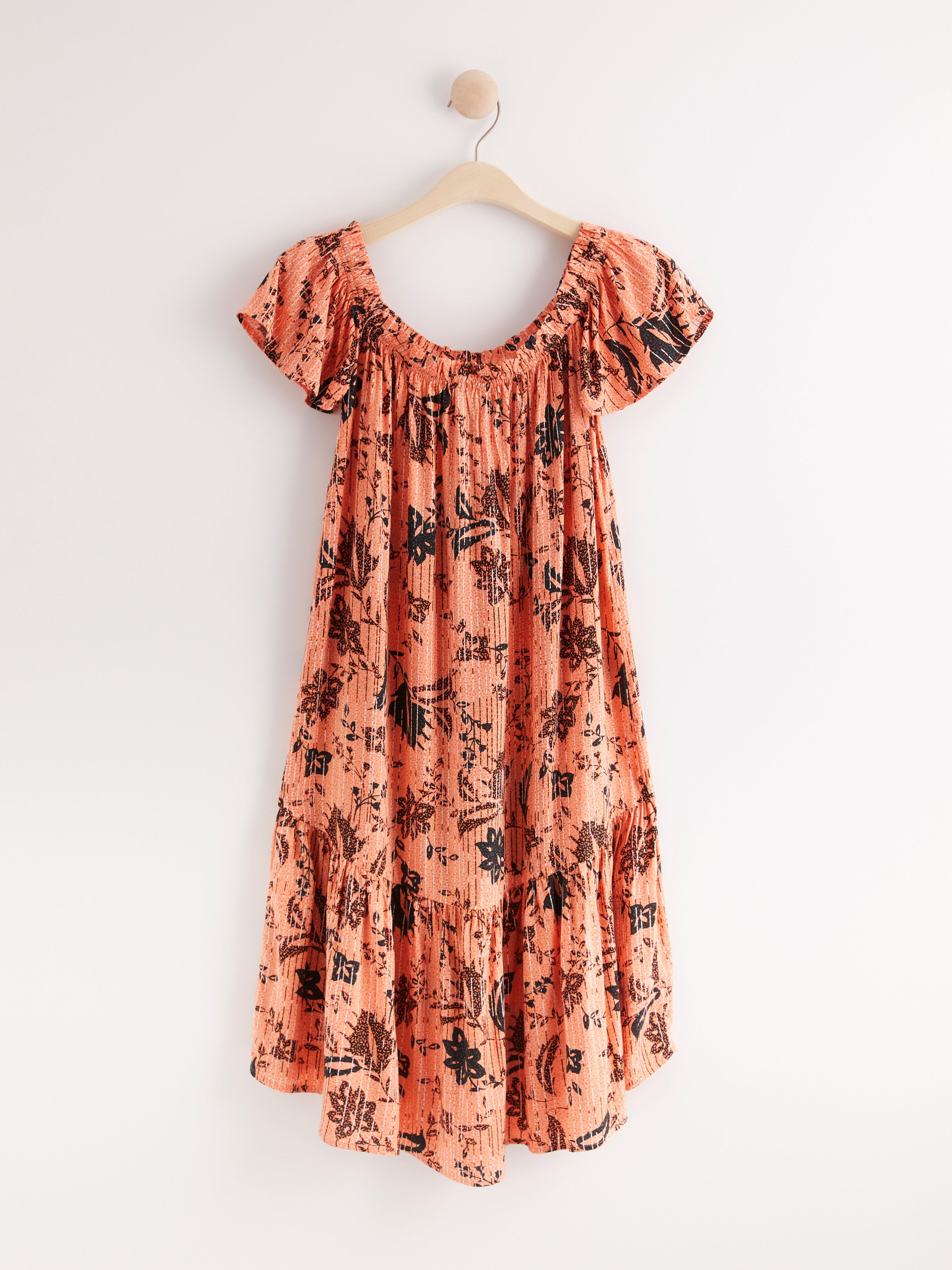 Off shoulder-klänning med volang