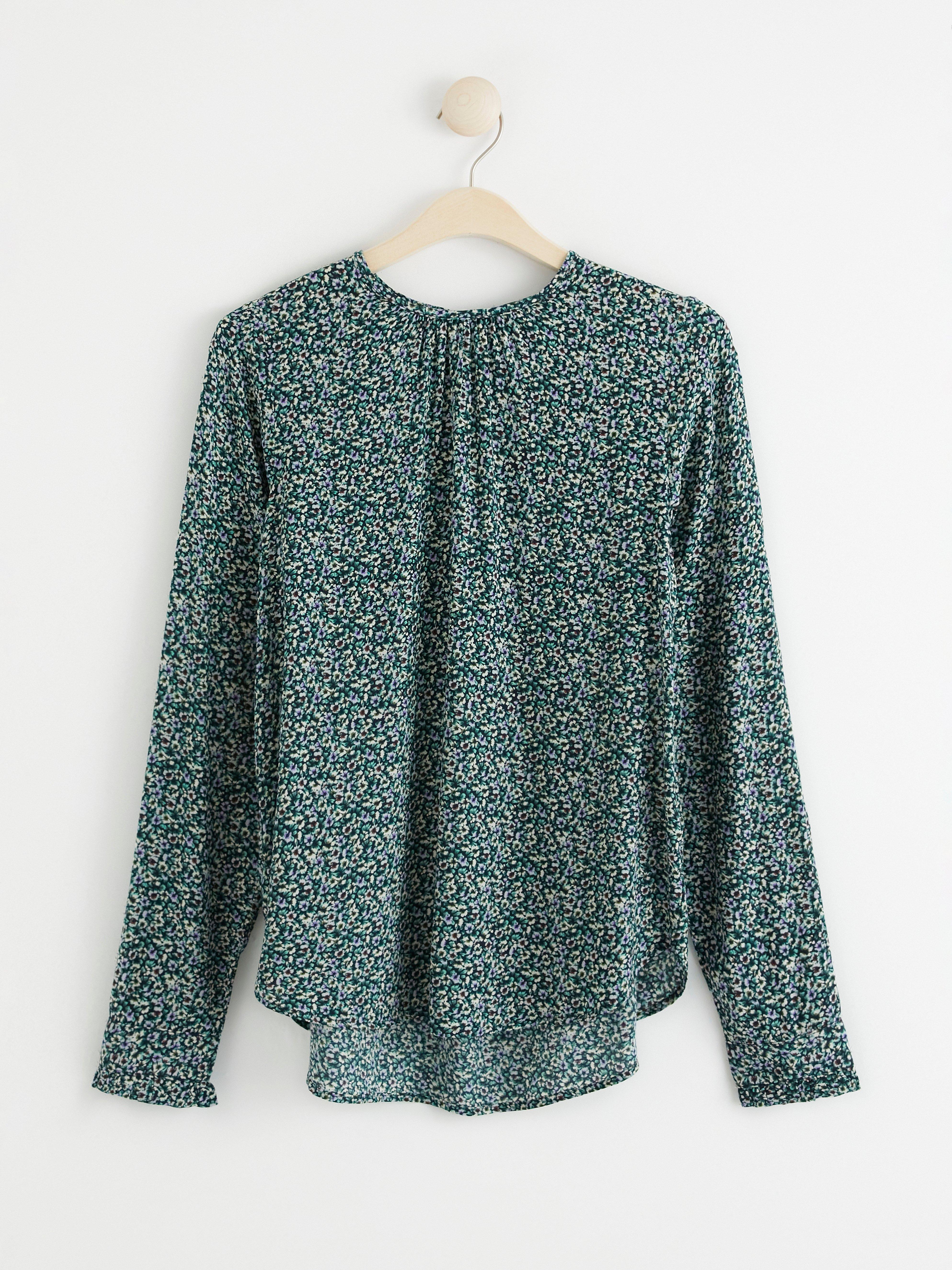 Långärmad blus med blommönster