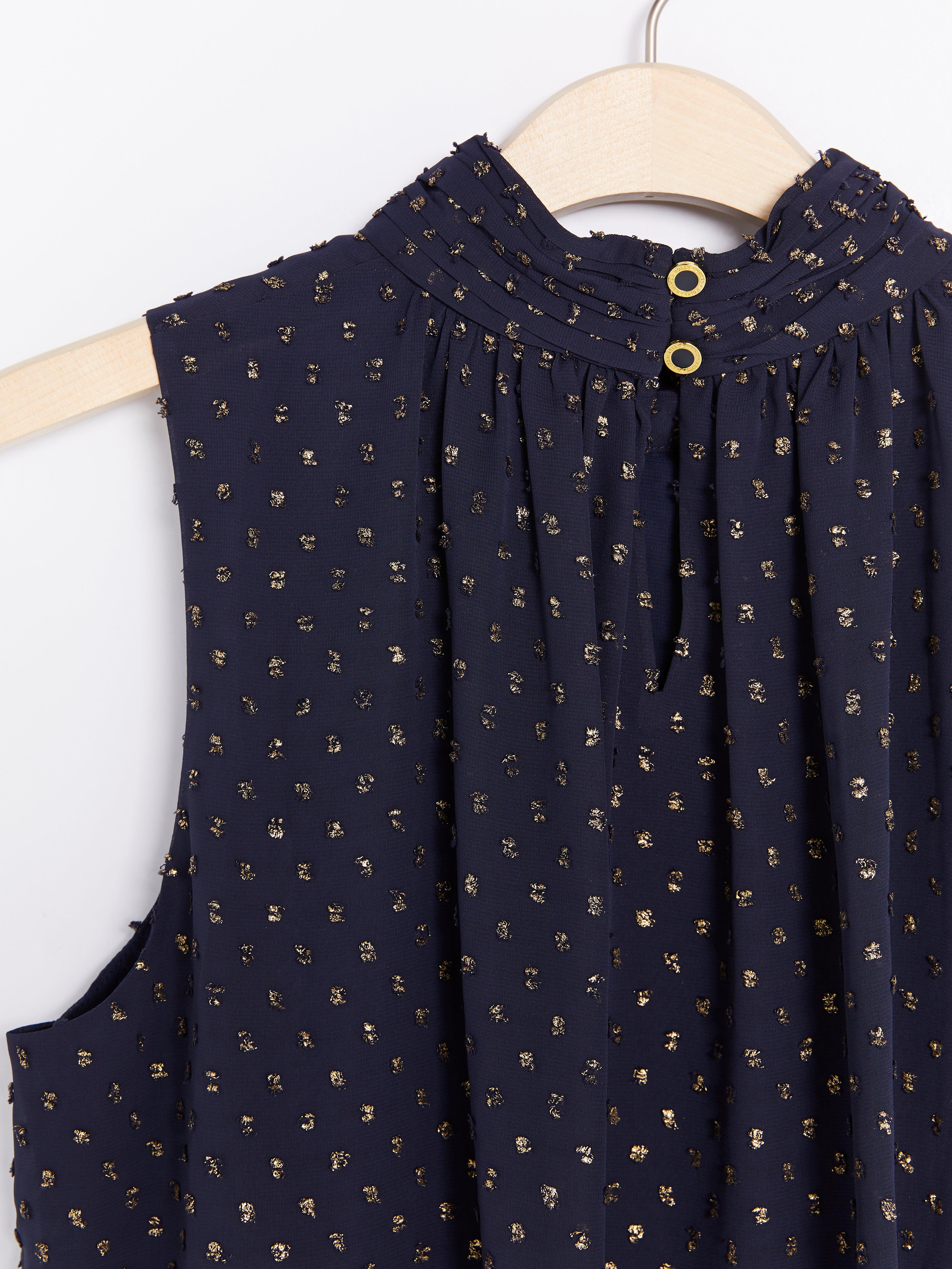 Ärmlös blus med krage