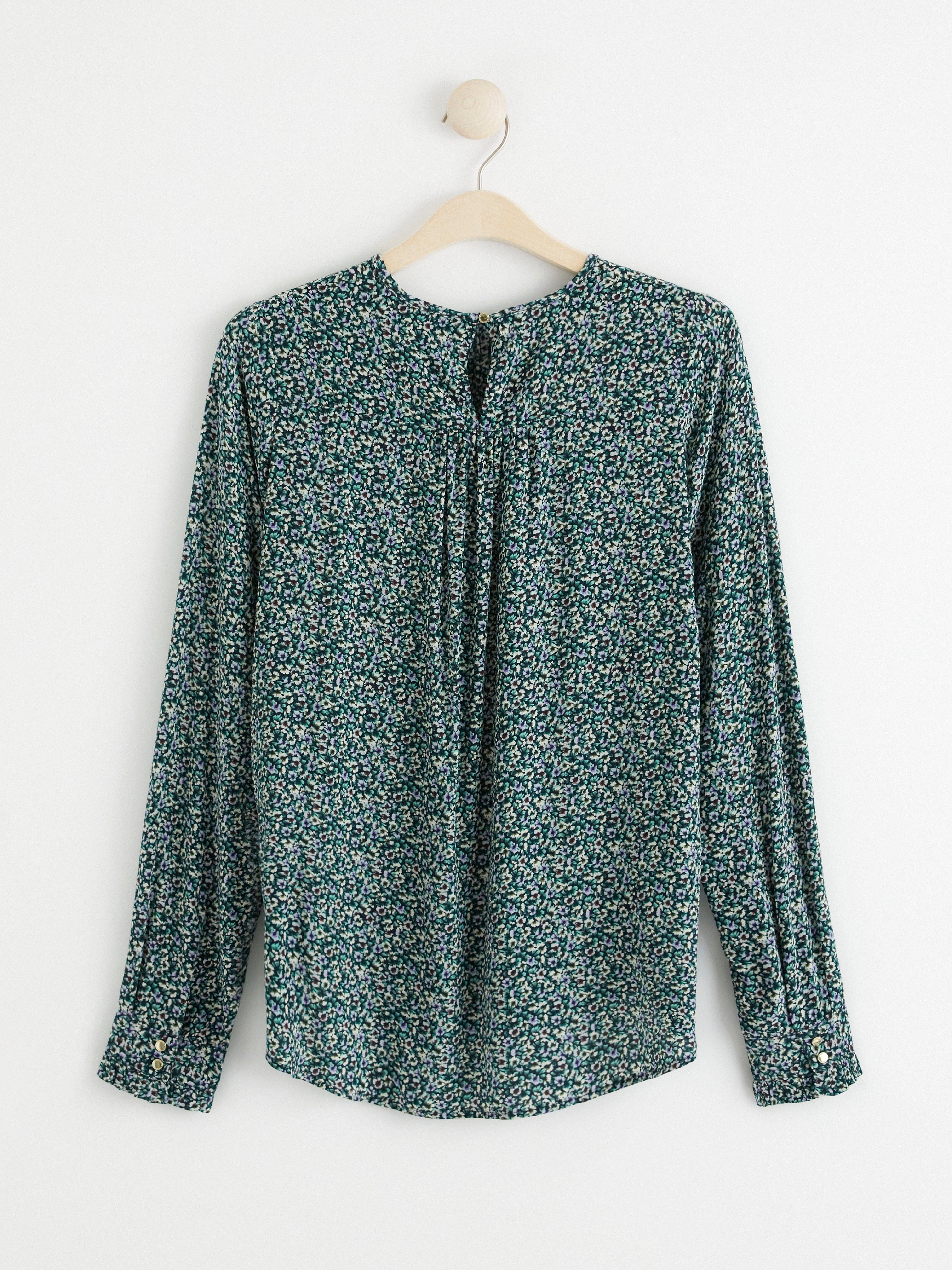 Långärmad blus med blommönster