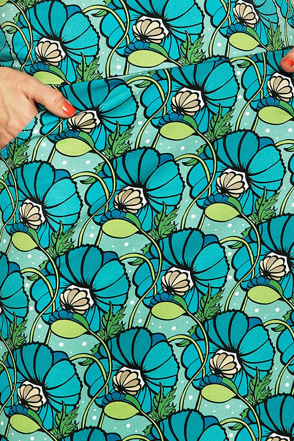 Cissi och Selma Majken kjol Kronblad Turkos | blommig trikåkjol med fickor